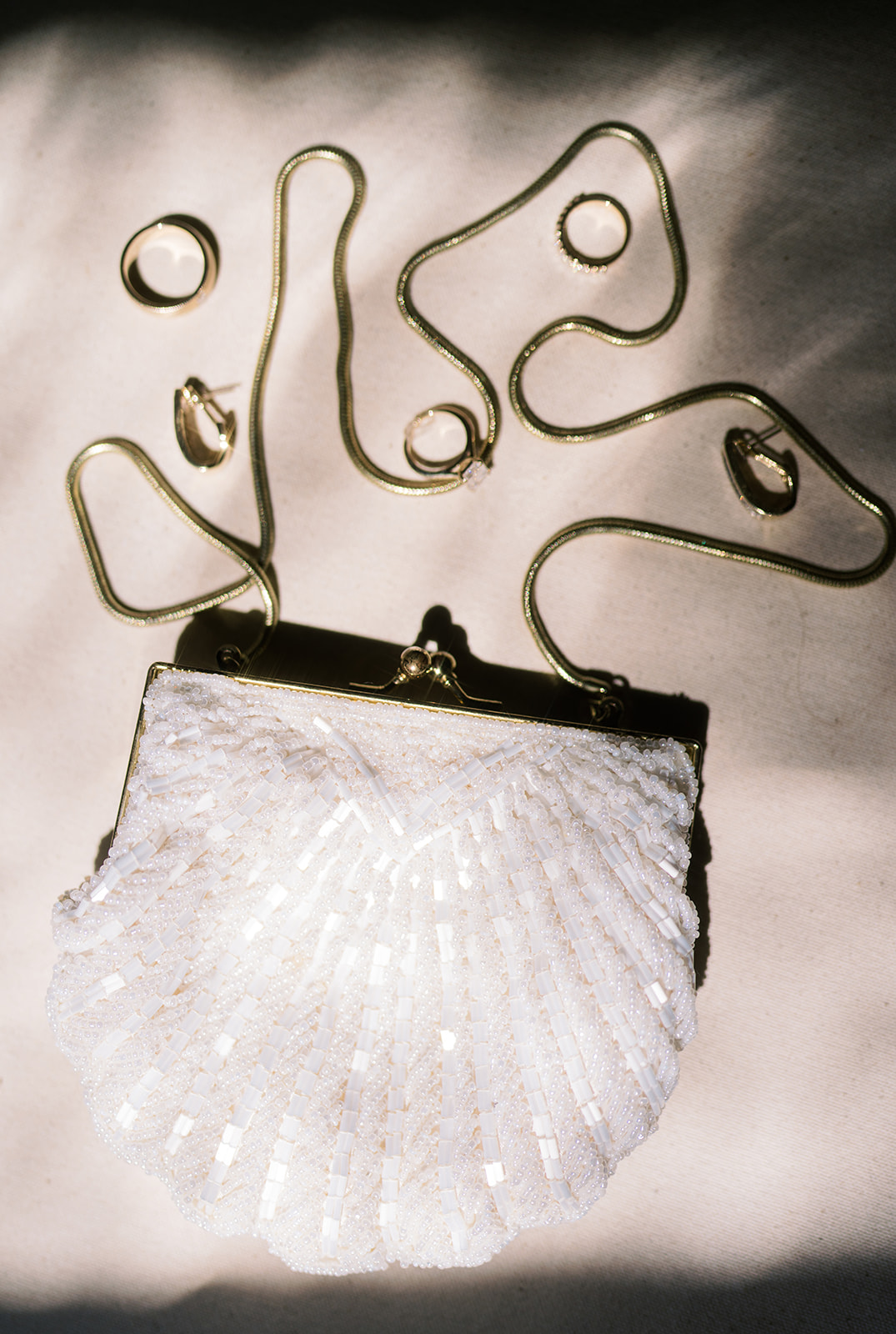 Bridal handbag and jewelry accessories from Olivia's wedding day