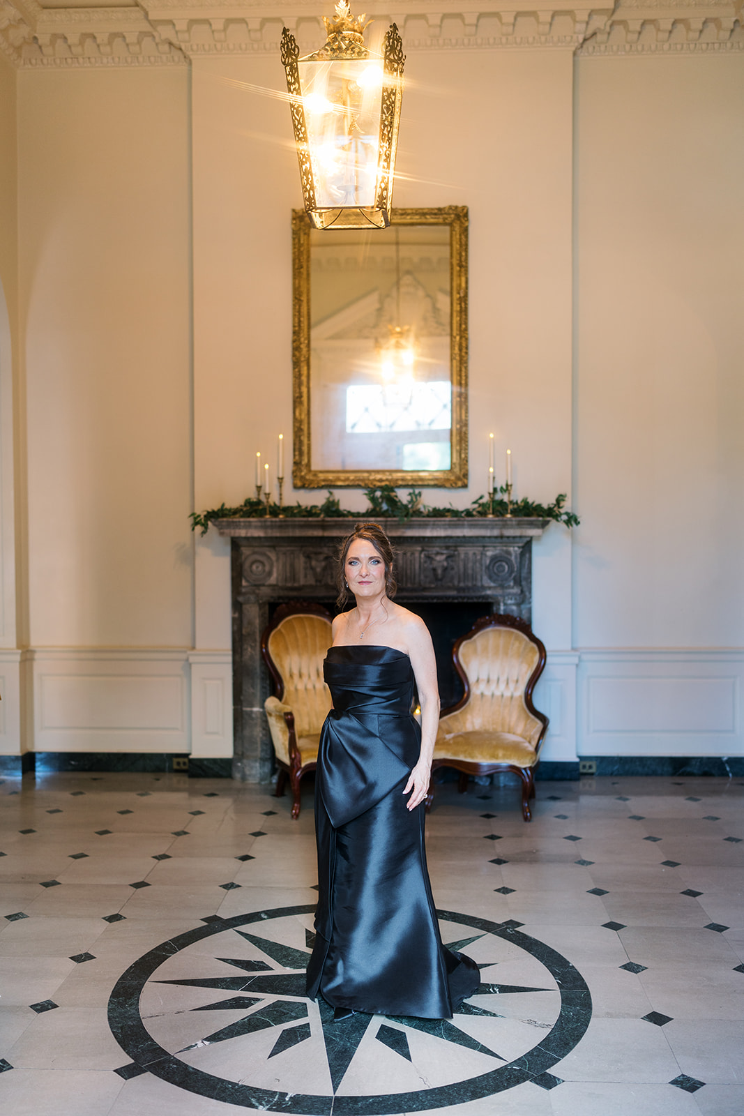 Olivia in an elegant bridal portrait by a mirror