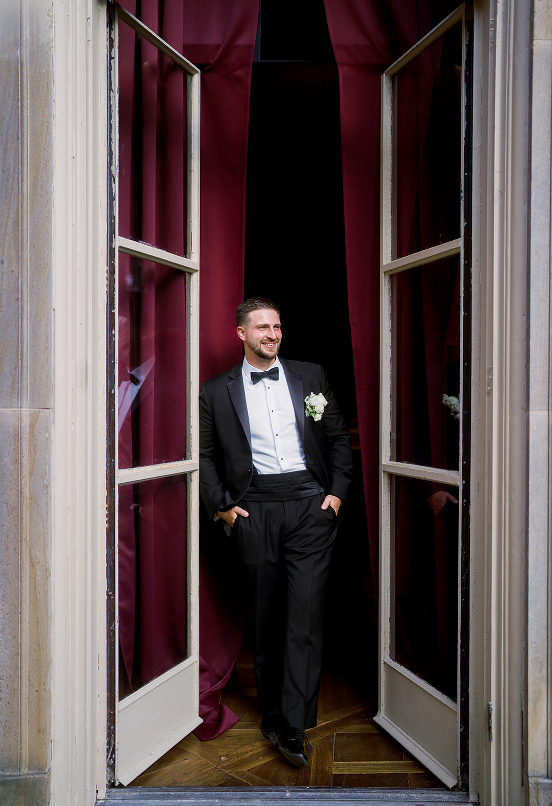 Olivia in an elegant wedding-day portrait near a doorway