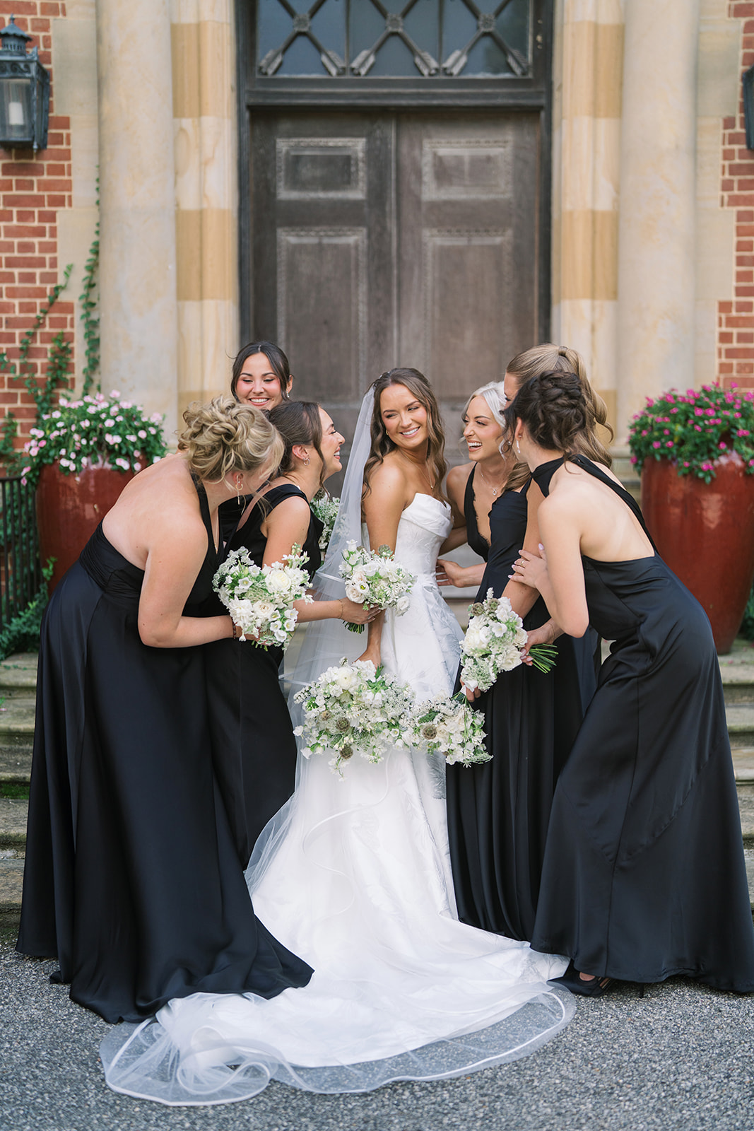 Olivia holding her bouquet in an outdoor bridal portrait, gallery view 3