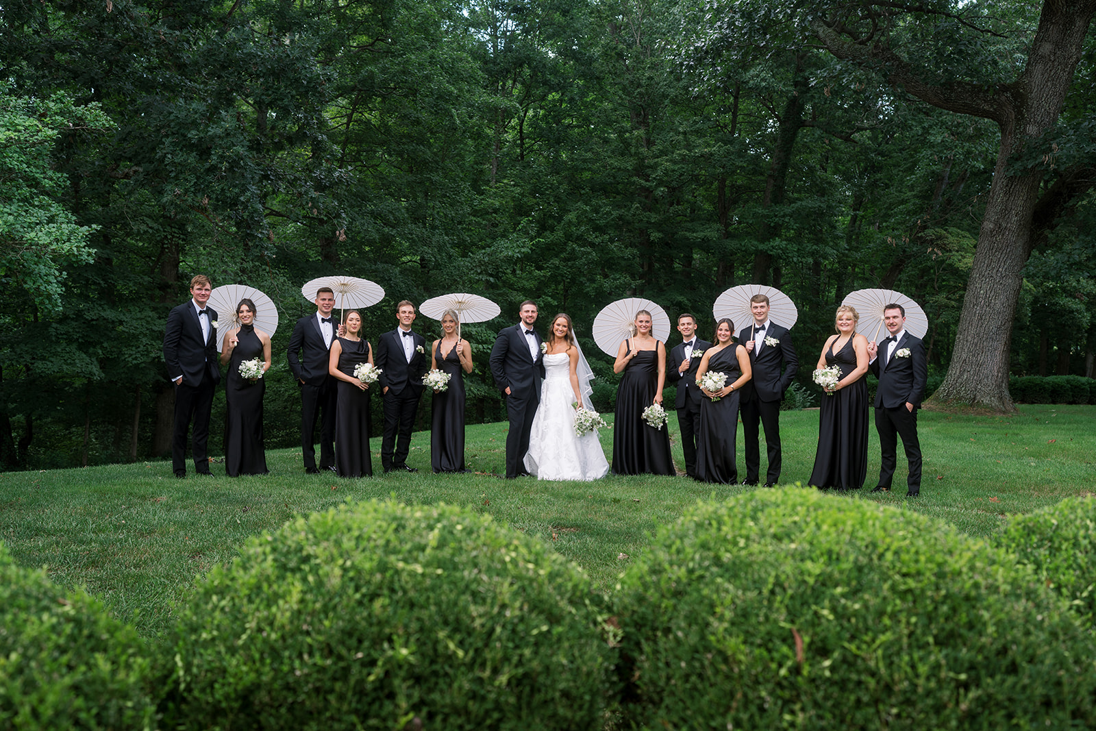 Olivia holding her bouquet in an outdoor bridal portrait, gallery view 5