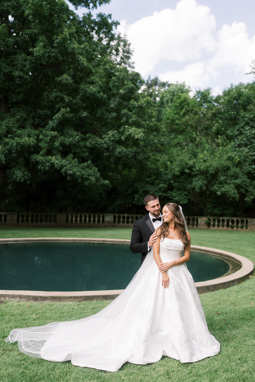 Olivia in her wedding gown during an outdoor portrait, gallery view 5