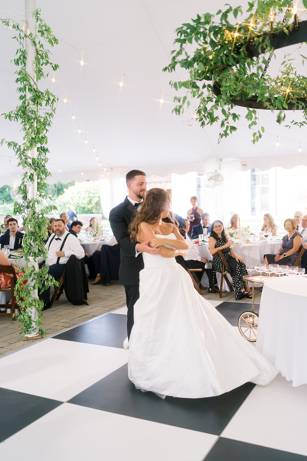 Wedding guests gathered outdoors during Zach and Olivia's celebration
