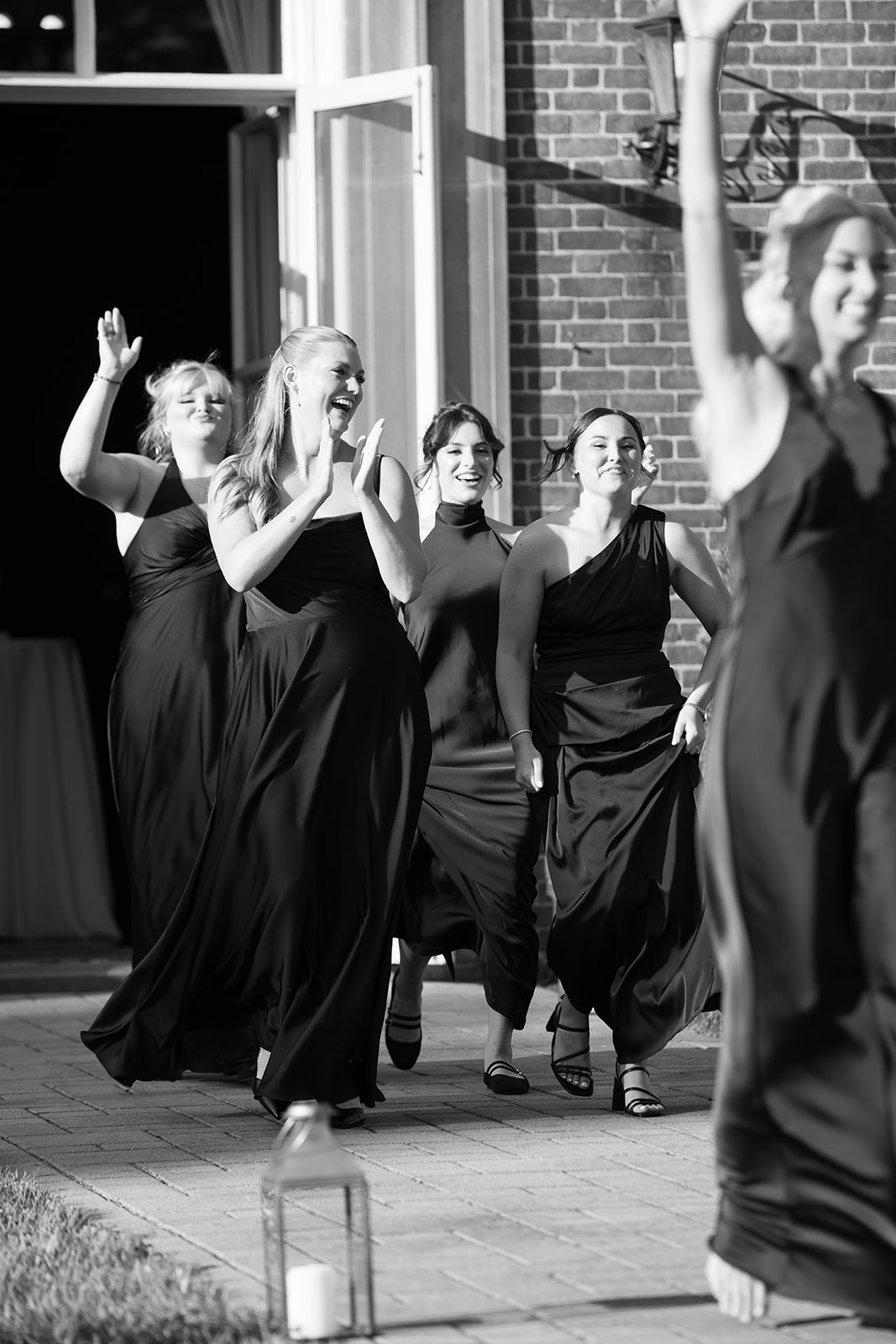 Wedding guests dancing outdoors at Zach and Olivia's Peterloon Estate reception